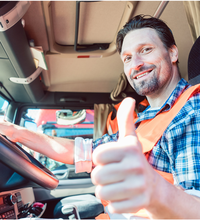 Driver giving a thumbs up from the cab